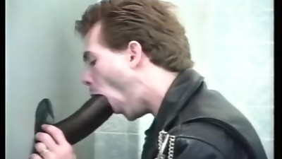 Gay glory hole cock sucking on the toilet